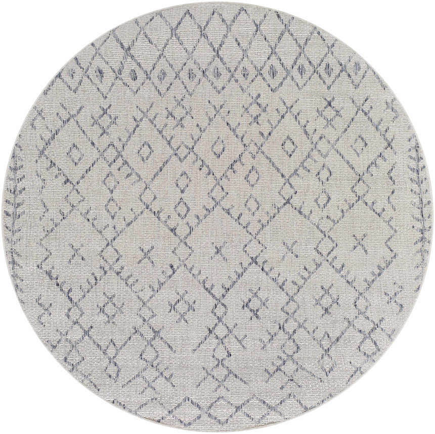 Close-up of a round Maunawili Blue Detailed Gray Rug. Features a geometric diamond pattern in blue and gray on an off-white background. Design-Round-67