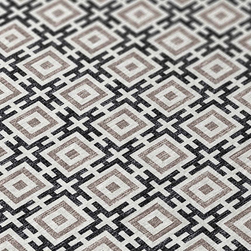 Close-up of the Dalyn Marlo MO1 Black Washable Area Rug. Features a geometric diamond pattern in black, chestnut, and ivory.