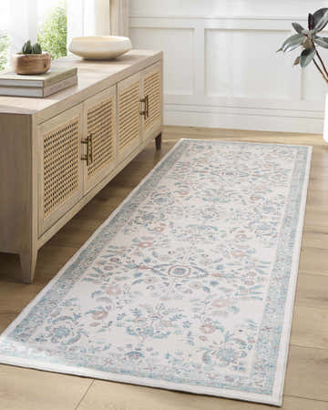 Hallway scene with a Meyly Pink & Green Washable Area Rug, light wood floors, and a matching console table. Roomscene-Runner