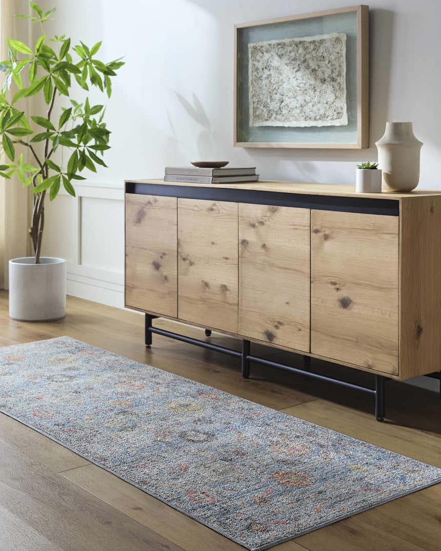Entryway scene with wood floors and the Maura Washable Area Rug in runner size, featuring aqua, orange, and gray tones. Roomscene-Runner