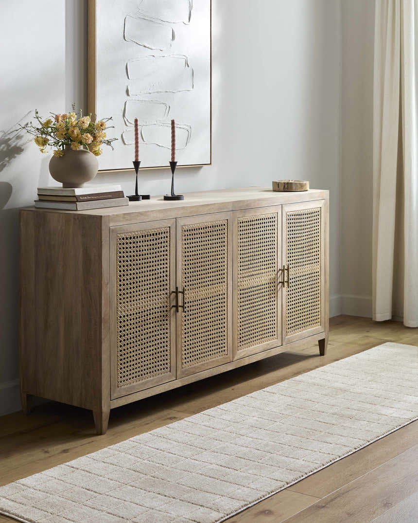 Living room scene with a beige Cascade Machine Woven PNW Home x LIVABLISS rug, wood floors, and a stylish cabinet. Roomscene-Runner