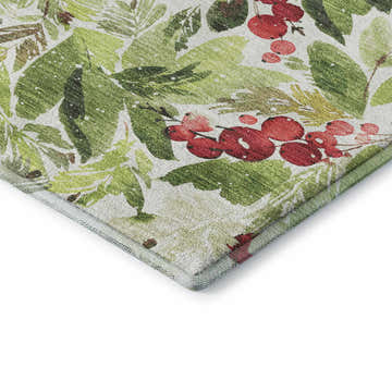 Close-up of the Dalyn Luxury Merry & Bright Aloe Washable Area Rug. Features a holiday design with green leaves and red berries.