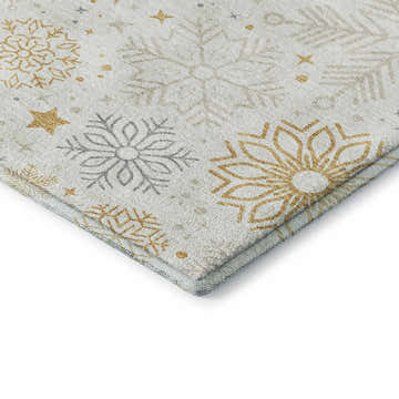 Close-up of Dalyn Luxury Merry & Bright MY25 Ivory Washable Area Rug with gold and taupe snowflake pattern.
