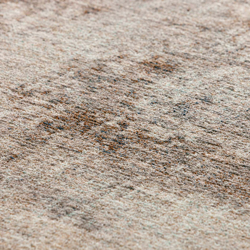 Close-up of the Dalyn Neola NA8 Taupe Area Rug showing beige, brown, and black fibers. Transitional style rug texture.