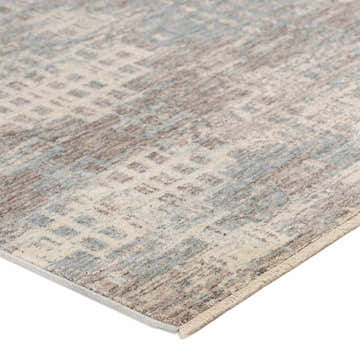 Close-up of the Dalyn Neola NA9 Denim Area Rug. Features a transitional pattern in denim, taupe, ivory, and chestnut.