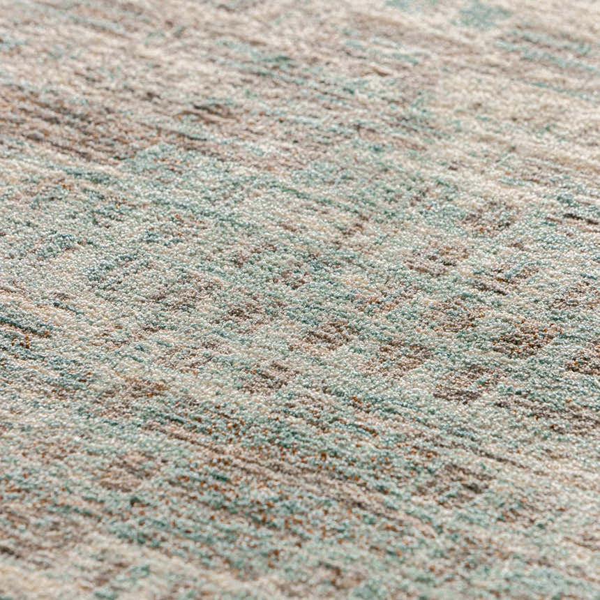 Close-up of the Dalyn Neola NA9 Denim Area Rug showing its texture and colors: denim, chestnut, taupe, ivory, and light blue.