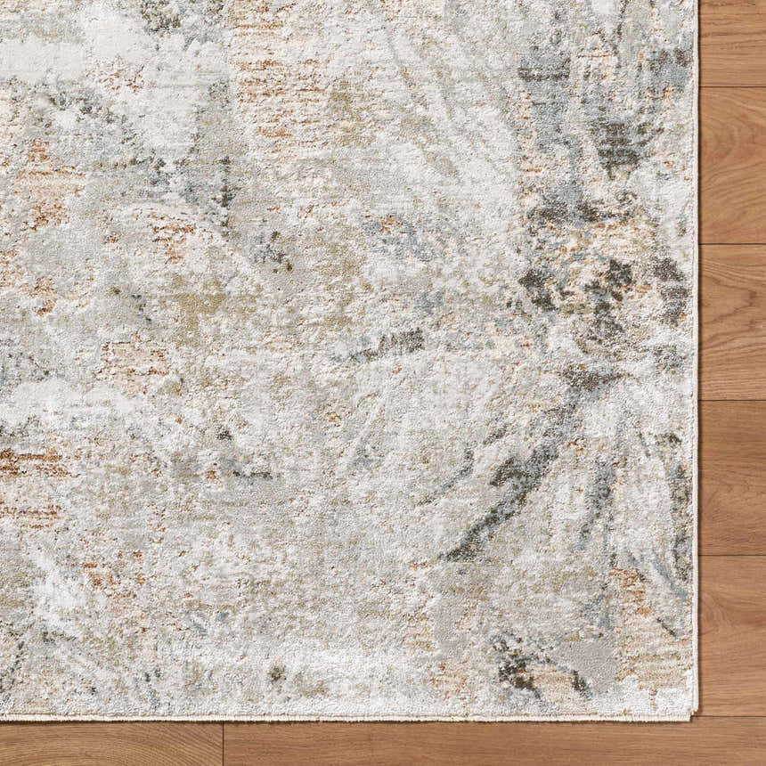 Close-up of the Nurit Sage Thick Luxe Boutique Rug showing charcoal, cream, brown, and gray abstract Southwestern pattern. Corner