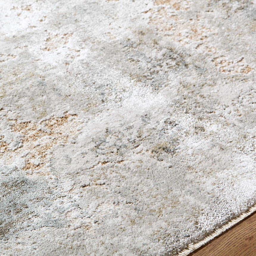 Close-up of the Nurit Sage Thick Luxe Boutique Rug showing its texture and colors: cream, light brown, and light gray. Texture