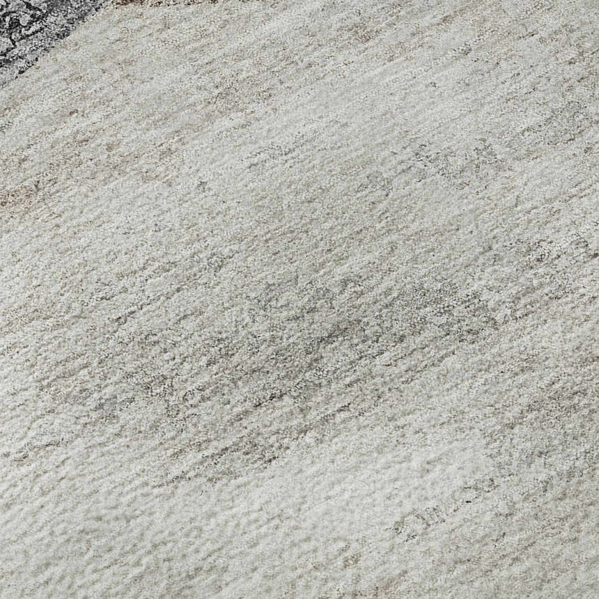 Close-up of the textured Dalyn Neo NO11 Silver Washable Area Rug in silver gray, ivory, and taupe.
