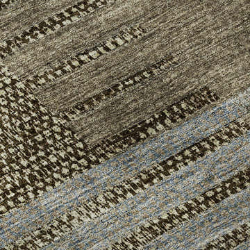 Close-up of the Dalyn Neo NO17 Taupe Washable Area Rug. Features beige, fudge, ivory, and silver gray tones.