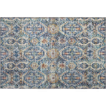 Close-up of the Dalyn Neo Denim Washable Area Rug. Features beige, caramel, chestnut, denim, and rust colors in a geometric pattern.