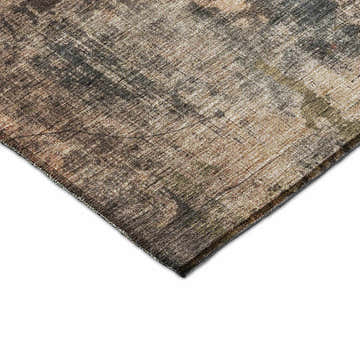 Close-up of the Nouveau NV12 Blue Washable Area Rug. Features beige, caramel, gold, and taupe hues with a distressed, contemporary design.