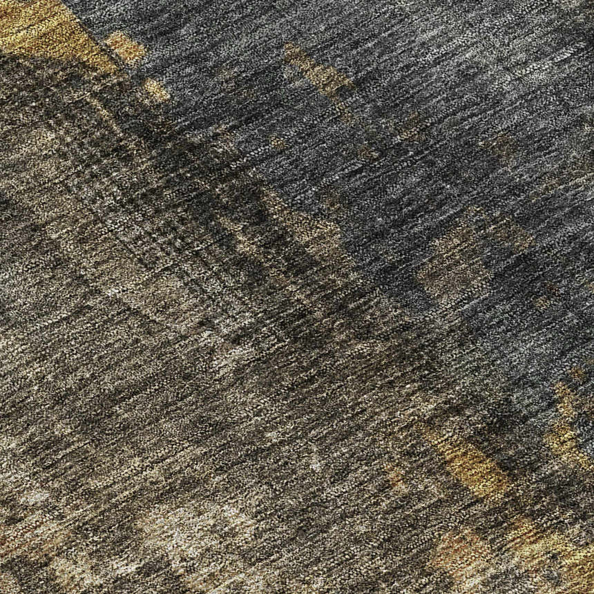 Close-up of the Dalyn Nouveau NV12 Gray Washable Area Rug. Features gold, silver gray, and taupe tones.