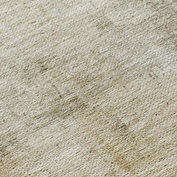 Close up of Dalyn Nouveau NV1 Linen Washable Area Rug. Beige, caramel, and taupe textured weave.