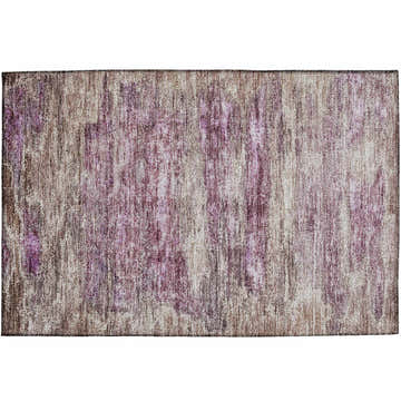 Close-up of the Dalyn Nouveau NV4 Blush Washable Area Rug. Features blush pink, chestnut, and light purple colors.