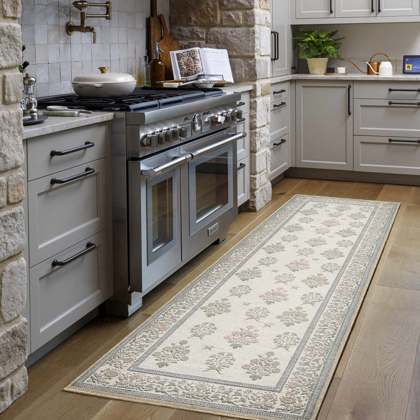 Kitchen scene with the Aquene Ivory Washable Area Rug runner, blush and sage floral pattern, wood floors, and gray cabinets. Roomscene-Runner