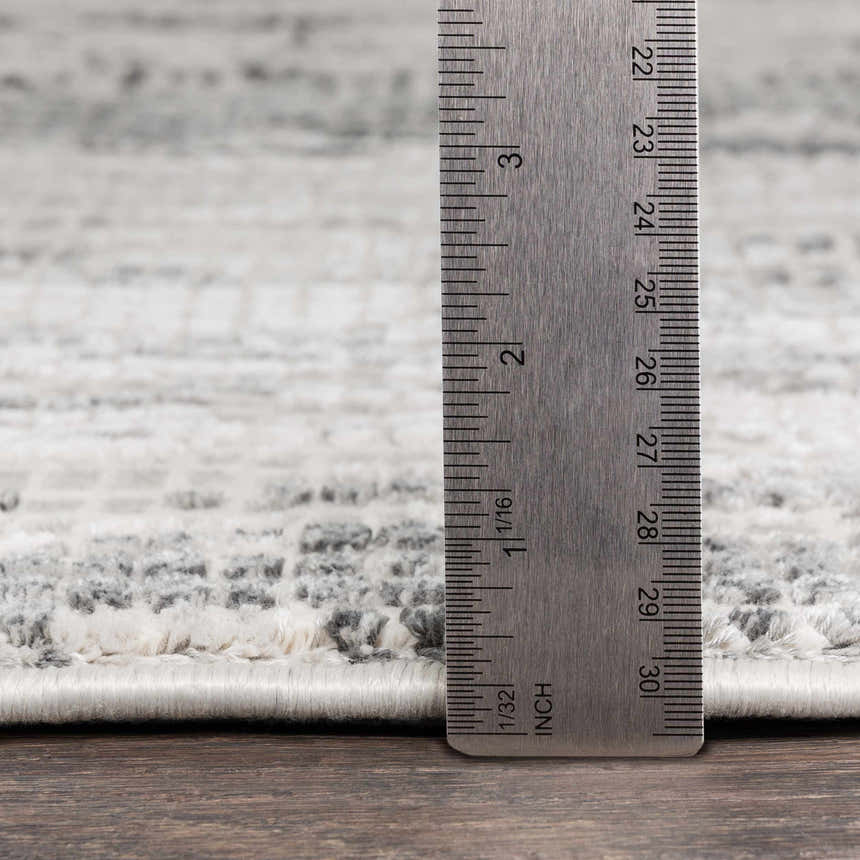 Close up of the Livabliss Aisha Surya AIS-2304 rug showing the pile height and gray, off-white pattern detail. Pile