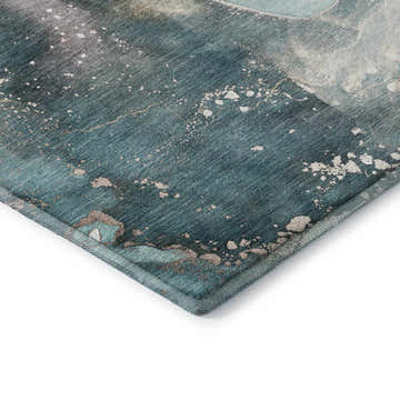 Close-up of the teal Dalyn Luxury Odyssey rug, showing its abstract pattern, soft texture, and bound edge.