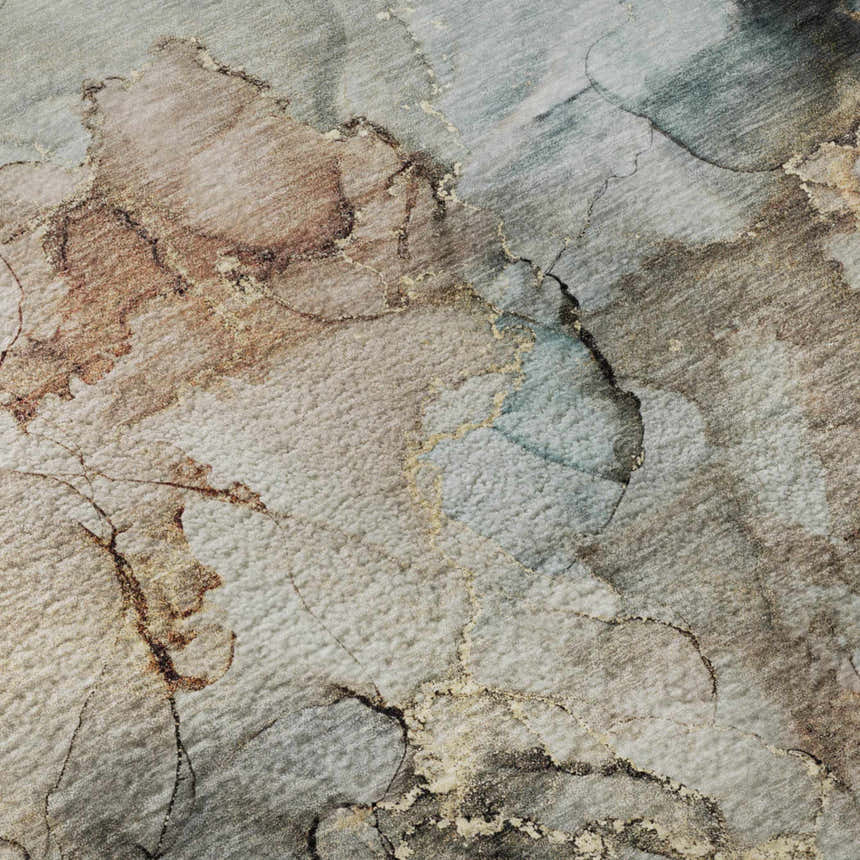 Close-up of the Dalyn Luxury Odyssey OY12 Tan Washable Area Rug. Beige, caramel, and light blue abstract pattern.