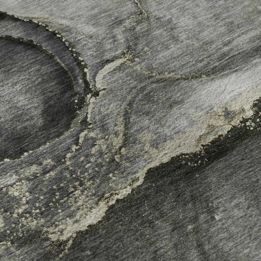 Close-up of the Dalyn Luxury Odyssey OY14 Charcoal Washable Area Rug, showing its gray, black, and taupe abstract pattern.