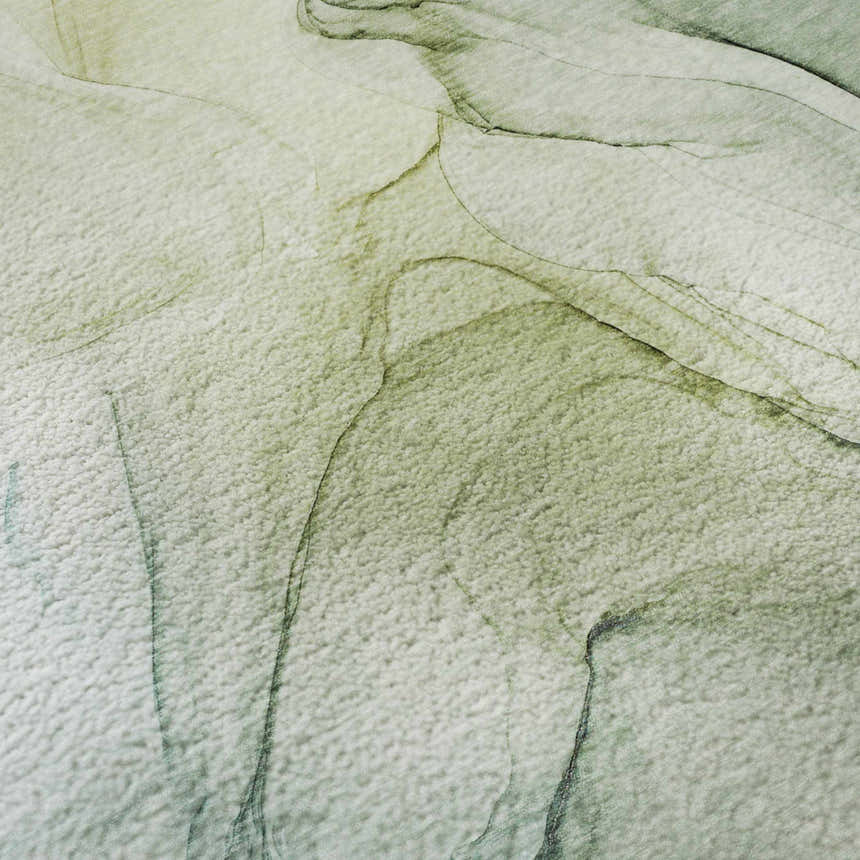 Close-up of Dalyn Luxury Odyssey OY Aloe Washable Area Rug. Abstract design in aloe, green, and taupe. Soft texture.