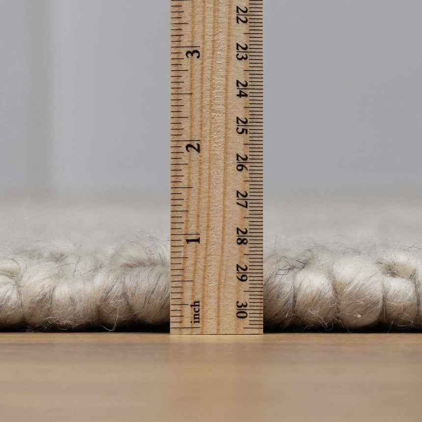 Penmaen Solid Cream Hand-Woven Wool Rug