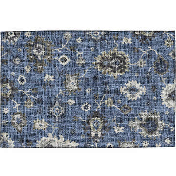 Close-up of the Dalyn Luxury Portico PO6 Blue Washable Area Rug. Features a floral pattern in chestnut, light blue, navy, and taupe.