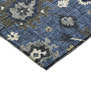 Close-up of Dalyn Luxury Portico PO6 Blue Washable Area Rug. Features floral pattern in chestnut, light blue, navy, and taupe.