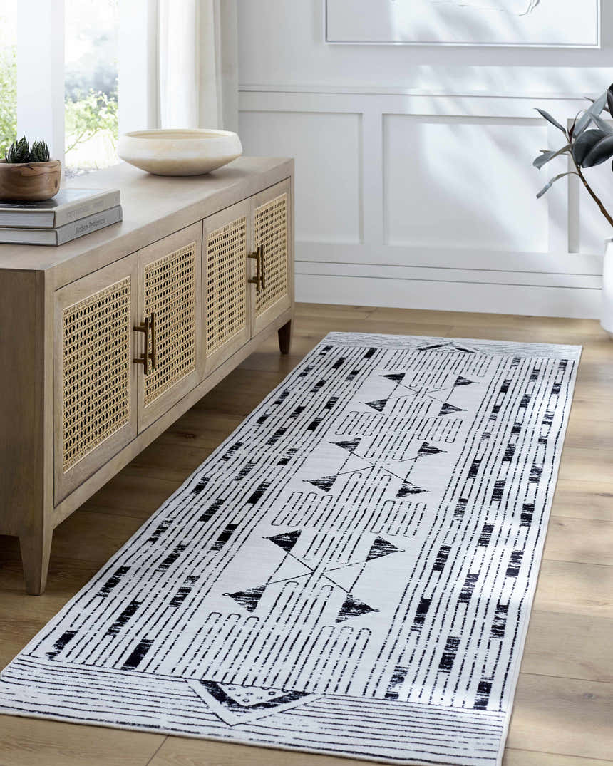 Entryway with light wood console table and Regis Washable Area Rug runner in gray, light silver, and white. Roomscene-Runner