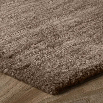 Close-up of the hand-loomed Dalyn Rafia RF100 Chocolate Area Rug, a brown wool rug with a soft, textured pile.
