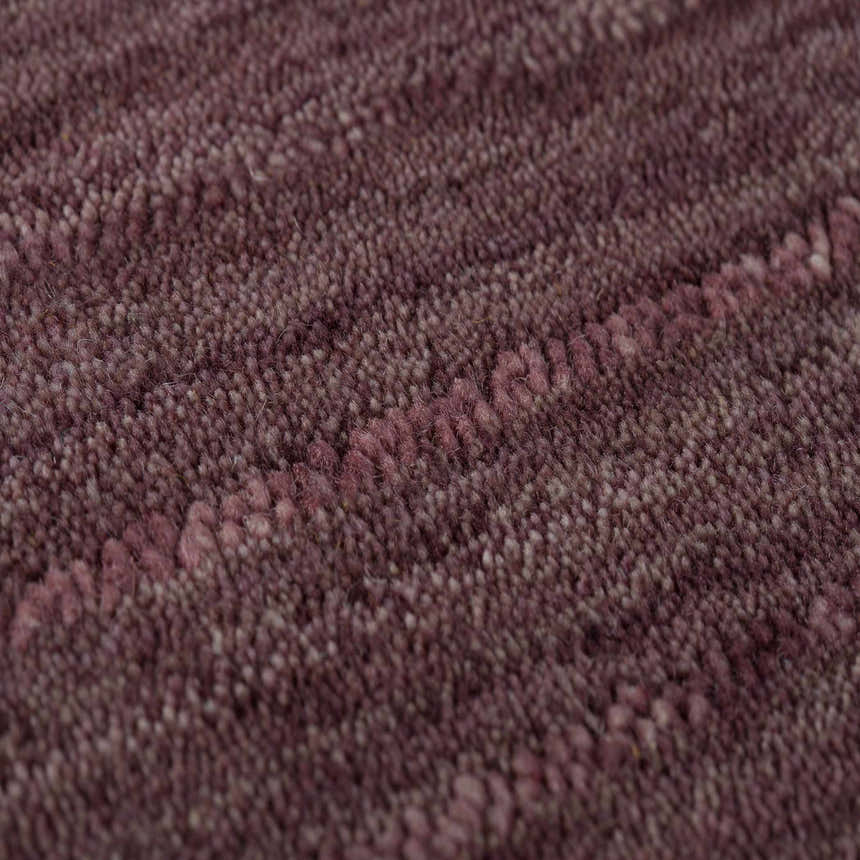 Close-up of the textured, hand-loomed Dalyn Rafia RF100 Plum Area Rug. Dark purple wool and cotton rug.