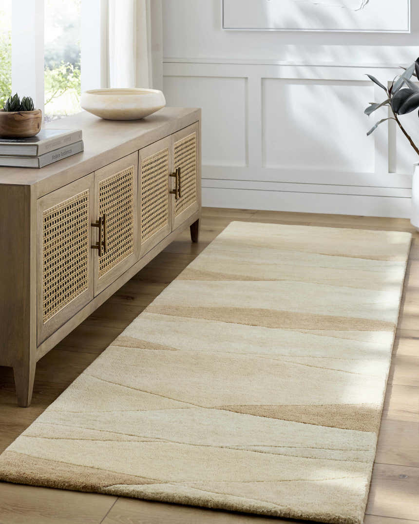 Entryway with caramel and cream Robin Modern Wool Rug, wood console table, and light wood floors. Roomscene-Runner
