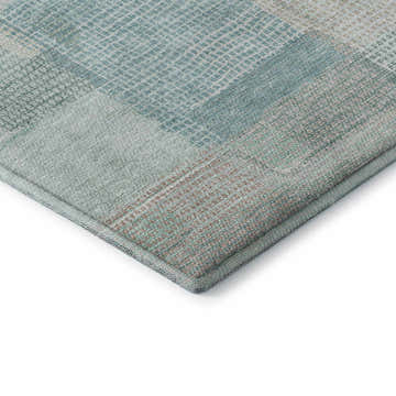 Close up of the Dalyn Luxury Ravenna RN10 Teal Washable Area Rug showing its teal, taupe, and ivory patchwork design.