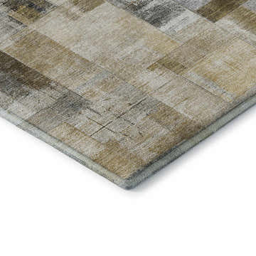 Close-up of the Dalyn Luxury Ravenna RN4 Granite Washable Area Rug. Beige, gold, and gray tones with a patchwork design.