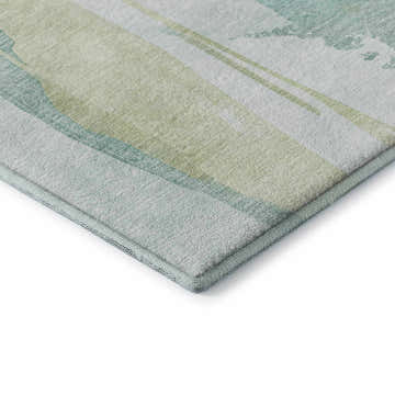 Close-up of Dalyn Luxury Ravenna RN7 Teal Washable Area Rug, showing aqua, beige, and teal watercolor-style stripes.