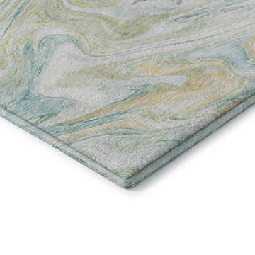 Close-up of the Dalyn Luxury Ravenna RN8 Sky Washable Area Rug. Features denim, gold, and sky blue marbled design.