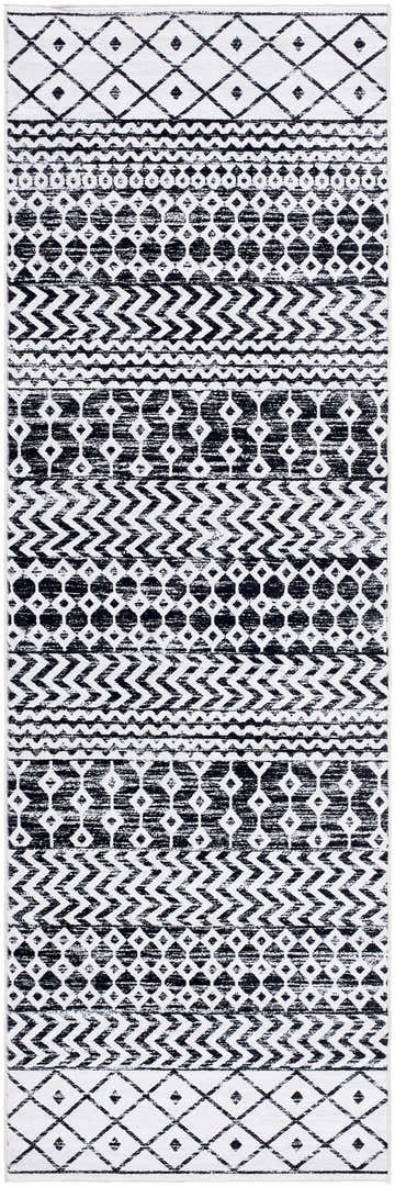 Close-up of the Royko Washable Area Rug. Black and white geometric patterns create a farmhouse, transitional style. Design-Runner-268
