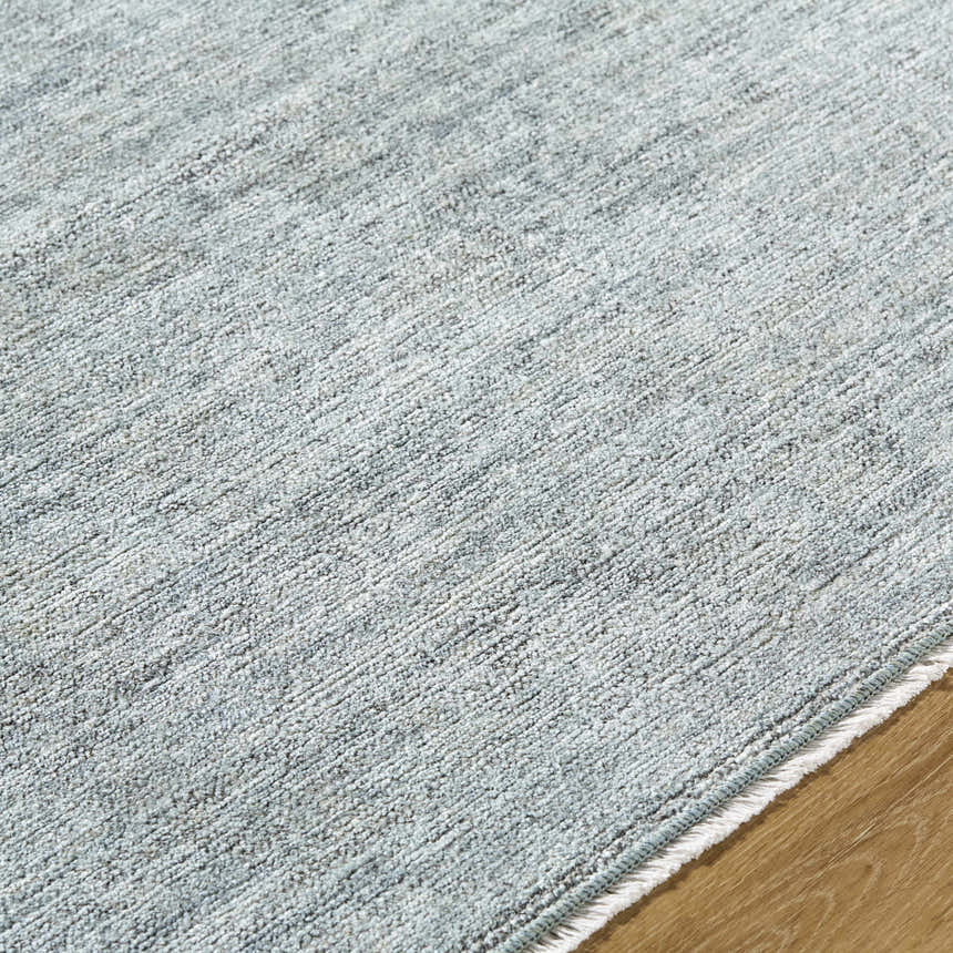 Close-up of the Livabliss x Galey Alix Maria Elena II rug, showing its texture and cream, gray, and black vintage medallion pattern. Texture