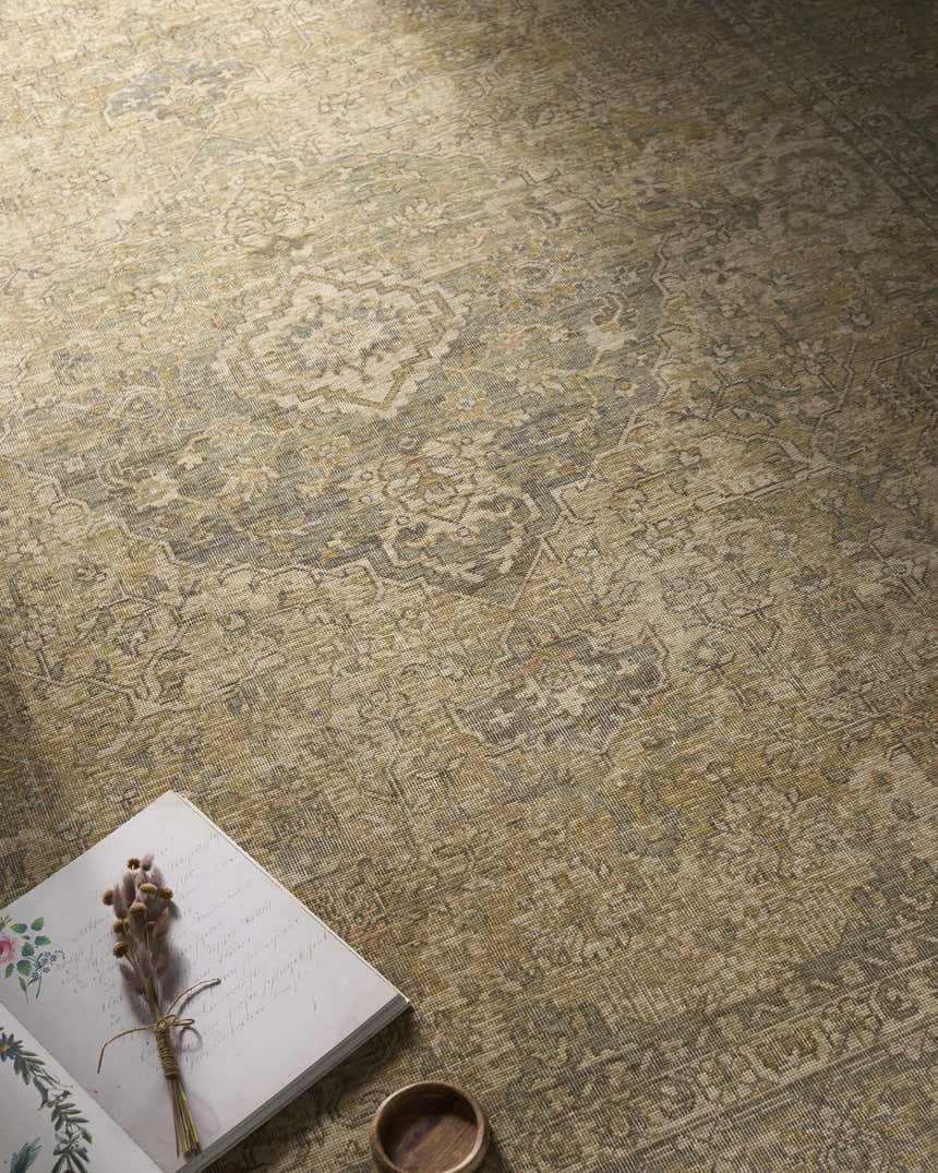 Close-up of the beige, tan, and brown Becki Beige Owens x Livabliss Renaissance Area Rug with traditional floral design. Styleshot