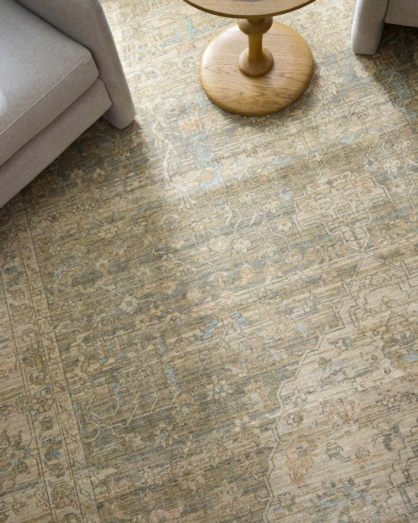 Close-up of Becki Owens x Livabliss Renaissance rug. Beige, denim, and coral traditional pattern with a farmhouse style. Styleshot