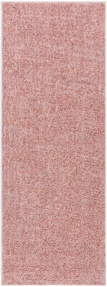 Close-up of the Judy Pink Plush Washable Area Rug, showing its soft texture and subtle pink color. Design-Runner-2773
