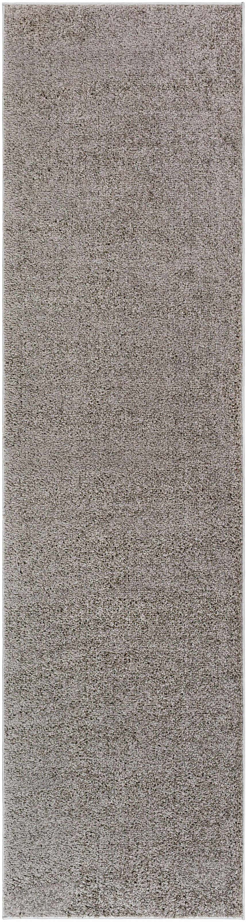 Close-up of the Judy Solid Dark Gray Washable Shag Rug, showing its soft, textured polyester pile and neutral gray color. Design-Runner-2710