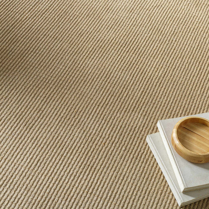 Close-up of the light brown Kimi Becki Owens x LIVABLISS rug showing jute texture and subtle diagonal pattern. Styleshot