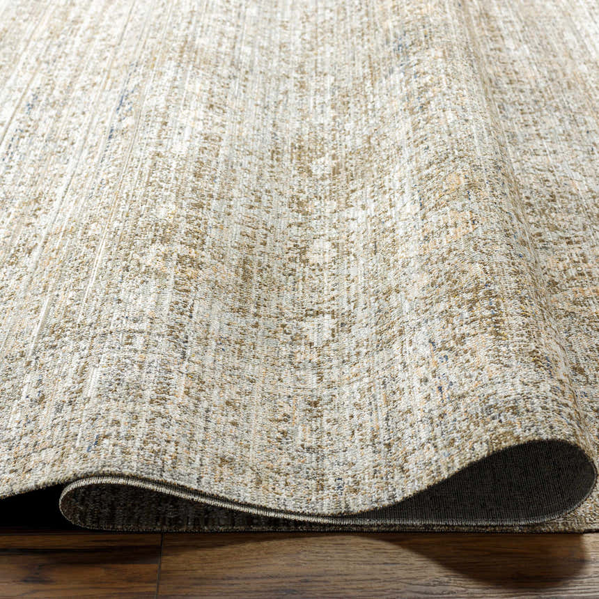Close-up of the Margaret Outdoor Becki Owens x LIVABLISS rug, showcasing its taupe, gray, and brown textured weave. Texture