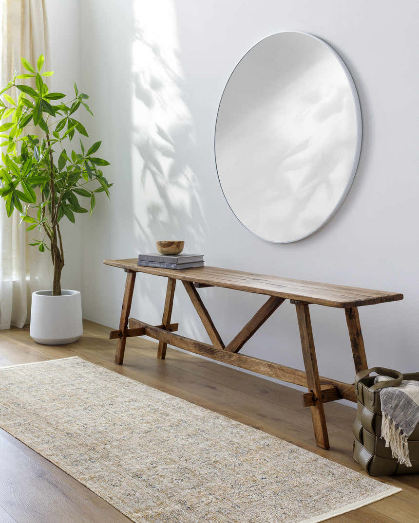Entryway with wood bench, round mirror, and Ren Outdoor Becki Owens x LIVABLISS runner rug in neutral tones. Roomscene-Runner