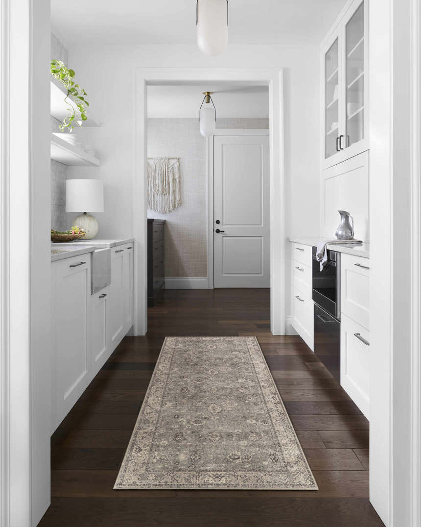Bright kitchen with white cabinets and Davina Becki Owens x LIVABLISS runner rug in charcoal, light gray, and taupe. Roomscene-Runner