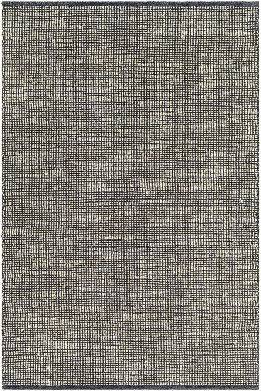 Close-up of the Byrne Black Jute Rug, a hand-woven rug with a natural jute and black grid pattern. Design-Rectangle-576