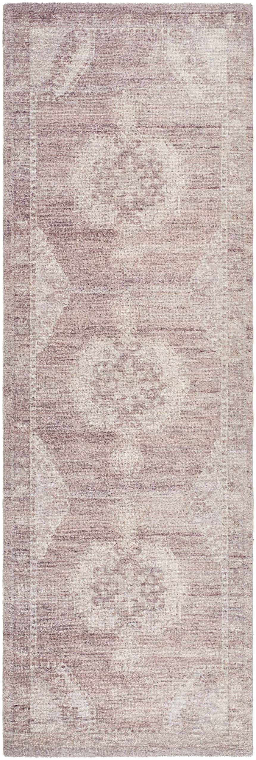 Close-up of the Alafin Area Rug. Hand-tufted polyester rug in blush, cream, dusty rose, and mauve with a traditional design. Design-Runner-268