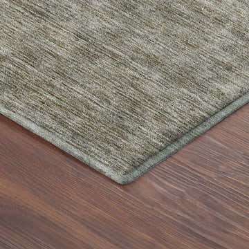 Close-up of the Dalyn Luxury Soft Essentials SE1 Flax Washable Area Rug showing texture and color on a wood floor.