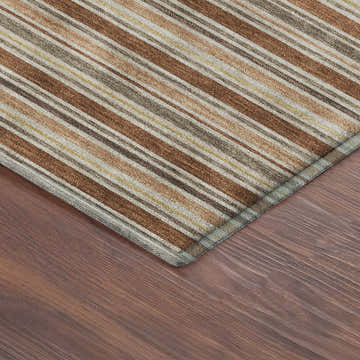 Close-up of Dalyn Luxury Soft Essentials SE2 Paprika rug. Features a striped pattern in paprika, brown, tan, and gray.